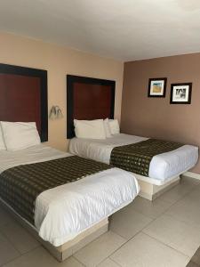 Voodi või voodid majutusasutuse Hotel Flamingo toas