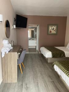 Voodi või voodid majutusasutuse Hotel Flamingo toas