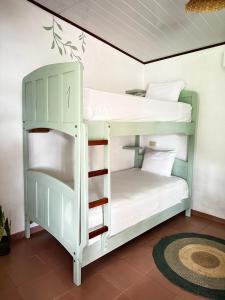 a couple of bunk beds in a room at Casa Manila in Santa Catalina