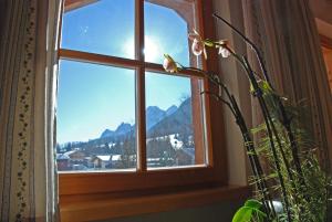 a window with a view of a mountain at Binterhof in Sesto