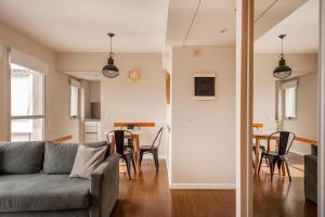 a living room with a couch and a table at Live & Enjoy Buenos Aires in Central Recoleta powered by Argenhost -A12J- in Buenos Aires +40 photos