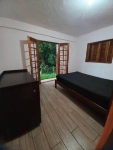 Postel nebo postele na pokoji v ubytování Sítio Casa Grande + 66 fotografií