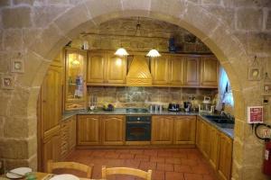 A kitchen or kitchenette at Id-Dwejra House of Character with private pool and Jaccuzi