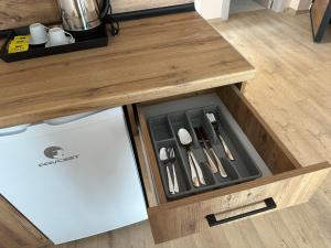 a drawer in a kitchen with utensils in it at NIKA The architect DIAMOND OF GEVGELIA in Gevgelija