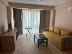 a living room with a couch and a table at NIKA The architect DIAMOND OF GEVGELIA in Gevgelija