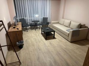 a living room with a couch and a table at NIKA The architect DIAMOND OF GEVGELIA in Gevgelija