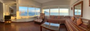 a living room with a view of the ocean at Islas del Sol in Mazatlán