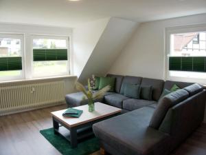 a living room with a couch and a coffee table at Classy apartment in Bad Sachsa in Bad Sachsa