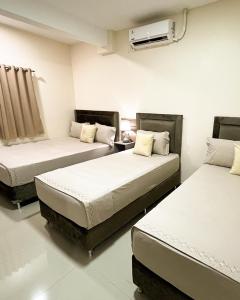 Ένα ή περισσότερα κρεβάτια σε δωμάτιο στο Darling Hotel Ciudad del Este