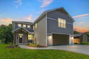 a rendering of a house with a garage at Sunset Cove home in Oshkosh