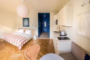 a kitchen and a bedroom with a bed and a sink at Pannonia View Delight in Budapest