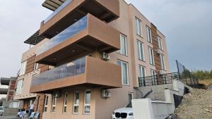 a building with balconies on the side of it at NIKA The architect DIAMOND OF GEVGELIA in Gevgelija
