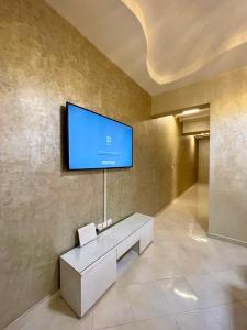 Μια τηλεόραση ή/και κέντρο ψυχαγωγίας στο Appartement Haut Standing en Plein Coeur de la Ville