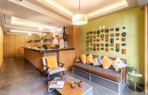 a living room with a couch and a table at Kukun Londres Juarez in Mexico City +50 photos