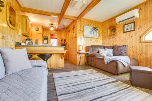 a living room with a couch and a table at Da Boat House with World-Class Bayou Fishing! in Houma