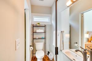 a bathroom with a toilet and a sink at 3 Mi to Duke Downtown Durham Cottage! in Durham +17 photos