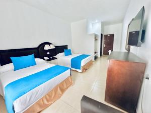 Кровать или кровати в номере Hotel Posada del Mar +27 фотографий