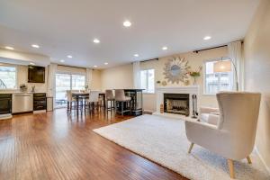 a living room with a fireplace and a dining room at Furnished Deck and Grill Reno Getaway! in Reno