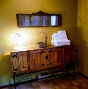 a wooden cabinet with a basket on top of it at Paradise Valley Oasis - Your Yellowstone Base Camp in Flying Y Ranch Airport +67 photos