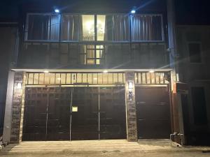 a building with two garage doors at night at Sunny Villa in Angeles