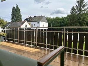 a balcony with a fence and a house at Greenview Apartment Trier - 3 beds 2 bedrooms in Trier