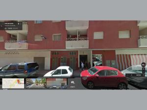 a group of cars parked in front of a building at Apartment Huerto in Torrevieja