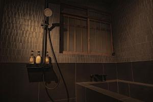 a shower in a tiled bathroom with a shower at CraftFlat Asakusa House in Tokyo