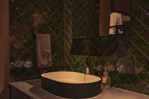 a bathroom with a bath tub on a counter at CraftFlat Asakusa House in Tokyo