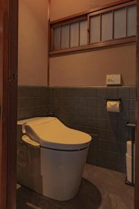 a bathroom with a toilet in a room at CraftFlat Asakusa House in Tokyo