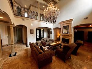 a large living room with couches and a chandelier at The Bayberry Retreat in Gainesville