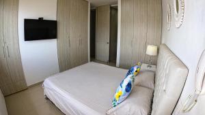 Postel nebo postele na pokoji v ubytování PENTHOUSE DE LUJO CON PLAYA PRIVADA en Pozos Clorados
