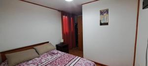 Postel nebo postele na pokoji v ubytování Hotel Cordillera Cabildo
