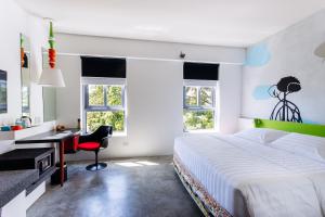 Postel nebo postele na pokoji v ubytování Canvas Boutique Hotel + 37 fotografií