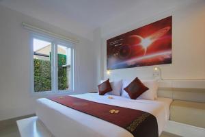 Postel nebo postele na pokoji v ubytování Mars City Hotel