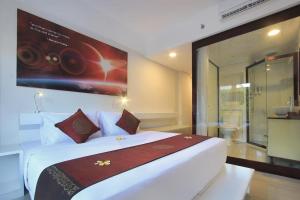 Postel nebo postele na pokoji v ubytování Mars City Hotel