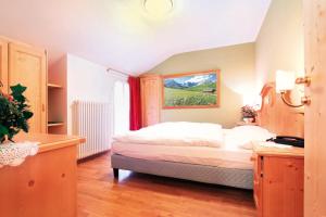 Postel nebo postele na pokoji v ubytování Hotel Bellevue