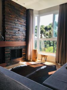 Et opholdsområde på Suíte encantadora Serra Class - Piscina aquecida