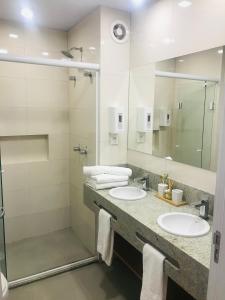 Et badeværelse på Suíte encantadora Serra Class - Piscina aquecida