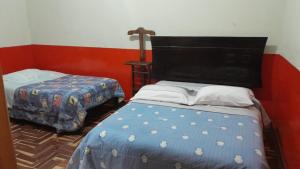 Postel nebo postele na pokoji v ubytování Hospedaje COLONIAL TARMEÑO + 1 fotografie