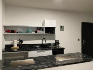 Kuchyň nebo kuchyňský kout v ubytování Apartamentos AEROPUERTO + 25 fotografií