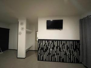 TV a/nebo společenská místnost v ubytování Apartamentos AEROPUERTO
