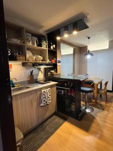 a kitchen with a counter and a table in it at Soccour Homestay by ekc in Marilao