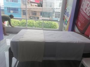 Postel nebo postele na pokoji v ubytování Ayahuasca Hostel