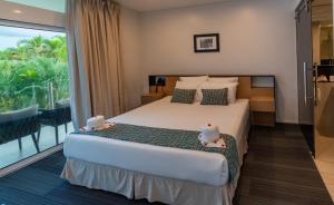 Postel nebo postele na pokoji v ubytování Taumeasina Island Resort
