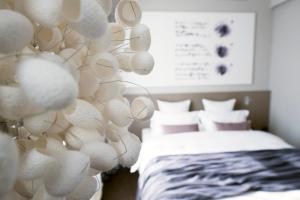Un pat sau paturi într-o cameră la Hotel Cubo