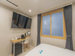 Voodi või voodid majutusasutuse Hotel Leo Changwon Central Branch toas