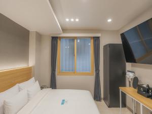 Voodi või voodid majutusasutuse Hotel Leo Changwon Central Branch toas