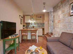 Телевизор и/или развлекательный центр в Apartment Borna - One-Bedroom Apartment with Terrace