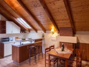a kitchen and dining room with a table and chairs at Country House Bakicevo - Two Bedroom Apartment with Terrace in Cilipi