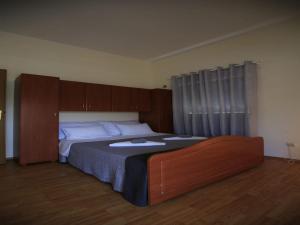 a bedroom with a large bed with wooden cabinets at Apartment Barbara - Two Bedroom apartment with Terrace in Vir